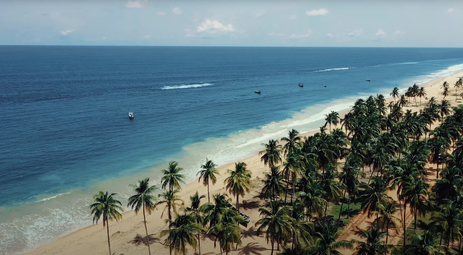 The coconut coast from the air, fishing boats offshore